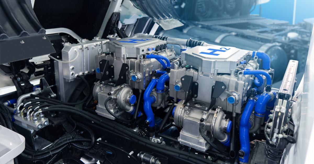 The open engine compartment of a hydrogen-fueled commercial truck showing the hydrogen fuel cell engine.