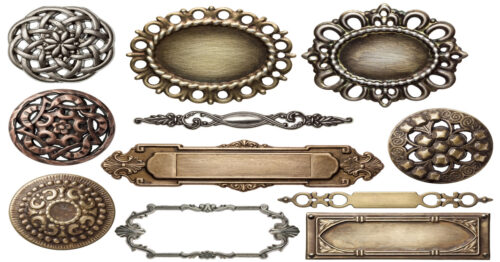A group of decorative metal frames with intricate designs surround one another against a white backdrop.